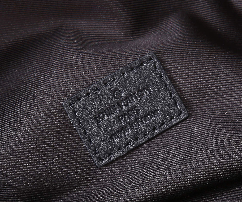 Louis Vuitton belt bag interior label patch on dark fabric lining