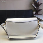 Coah white shoulder bag with rectangular shape, gold chain, and flap closure