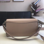 Coah bag shoulder bag back view with smooth taupe leather panel and crossbody strap.