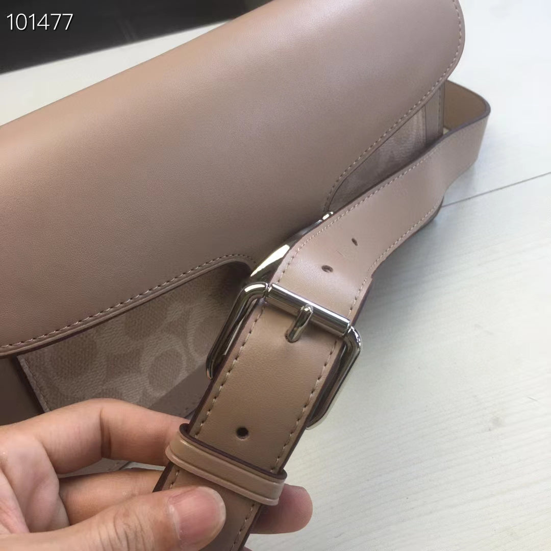 Coah bag strap end detail with buckle and adjustment holes, taupe leather.