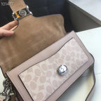 Coah bag top view with suede-look back, taupe flap, and logo panel with snap.