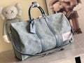 Louis Vuitton men’s bag, blue monogram canvas with leather trim and top handles