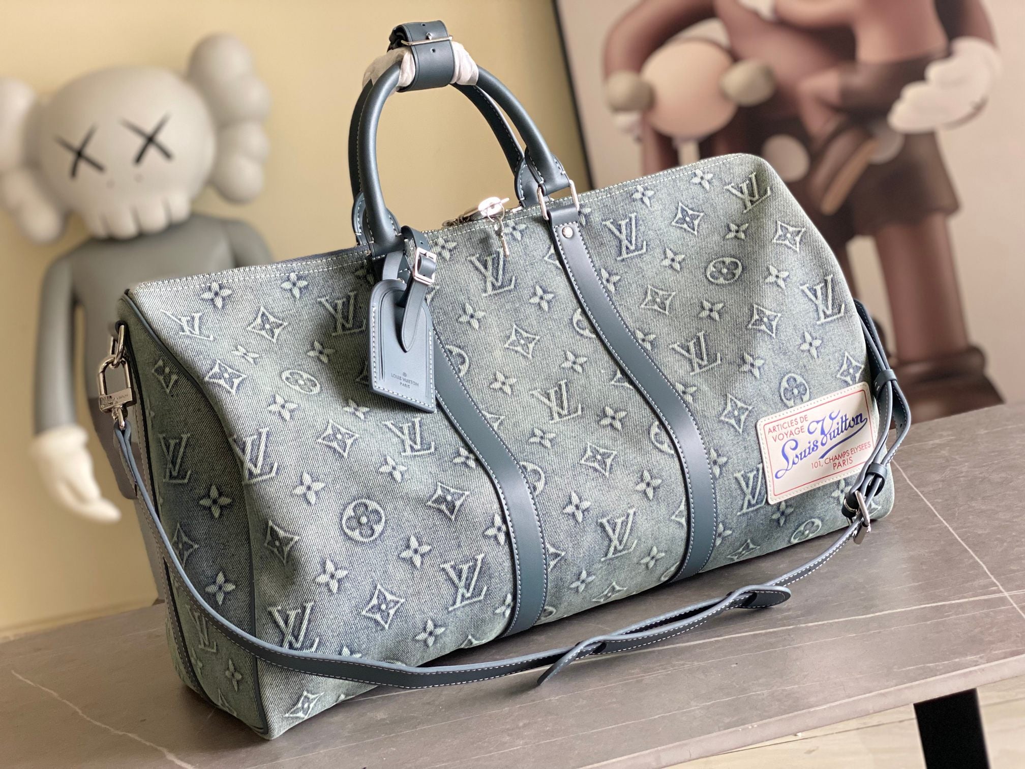 Louis Vuitton men’s bag, blue monogram canvas with leather trim and top handles