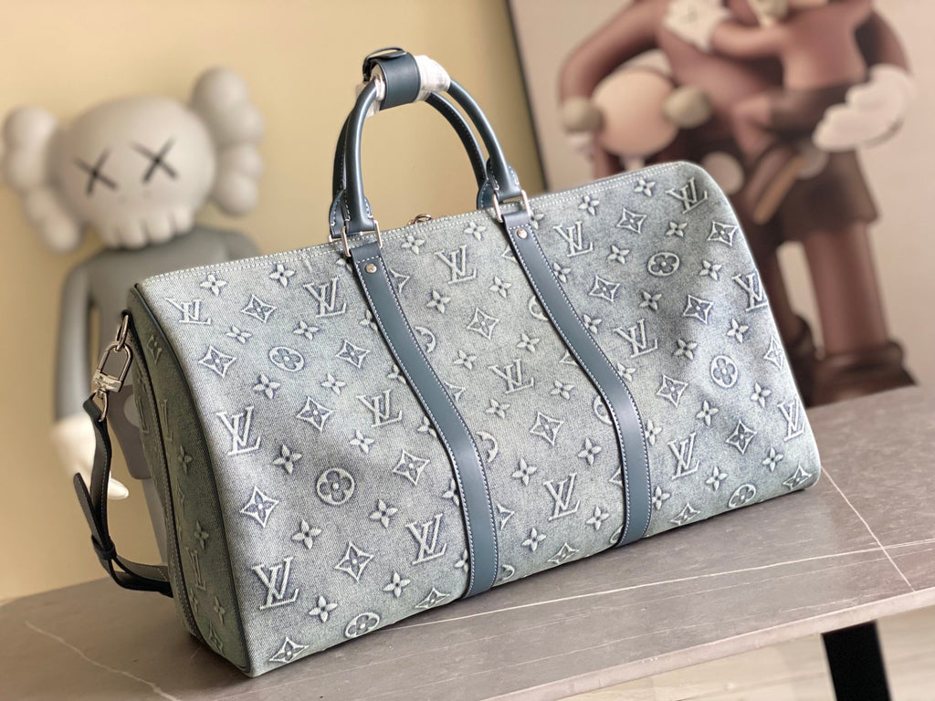 Louis Vuitton men’s bag, front view with two handles and blue monogram canvas