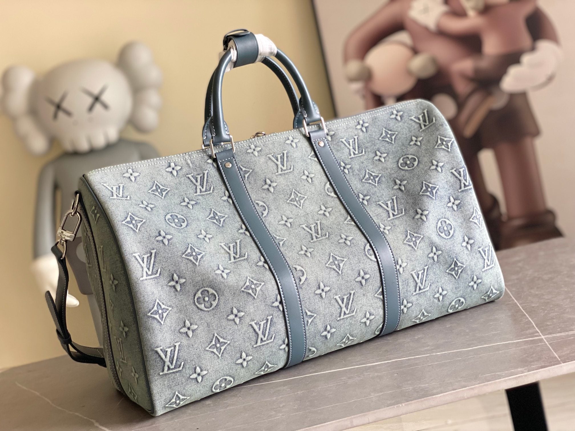 Louis Vuitton men’s bag, front view with two handles and blue monogram canvas