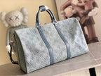 Louis Vuitton duffel bag with blue-gray monogram print, front zipper and shoulder strap