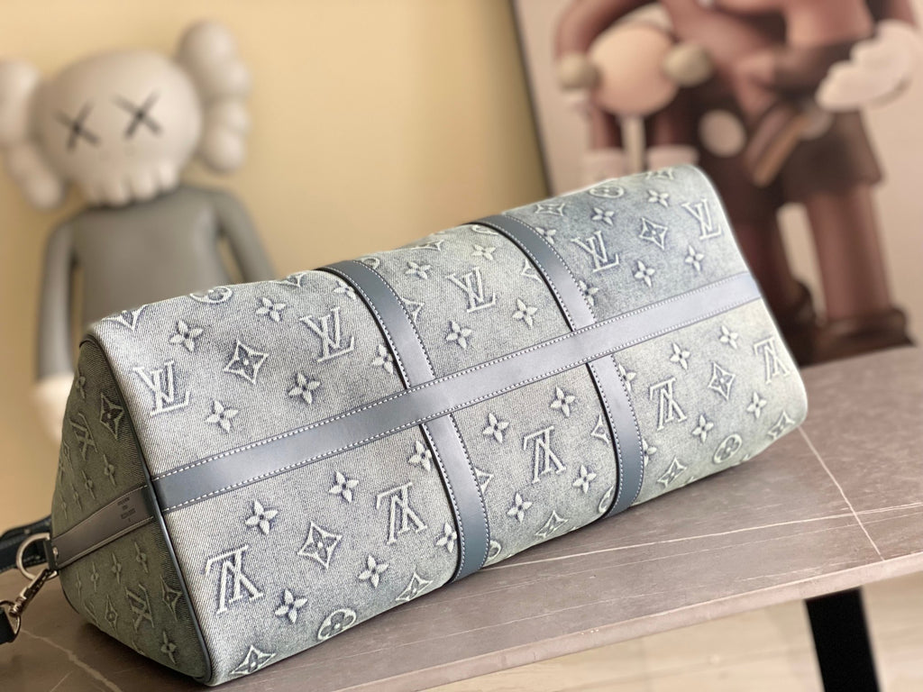 Louis Vuitton men’s bag, cylindrical shape with zipper and blue monogram pattern