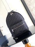 Dior backpack in dark monogram canvas, front zip pocket and top handle.