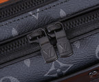 Louis Vuitton monogram bag zipper pull with black hardware, close-up detail
