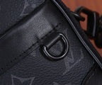Louis Vuitton monogram bag strap attachment ring with black hardware, close-up