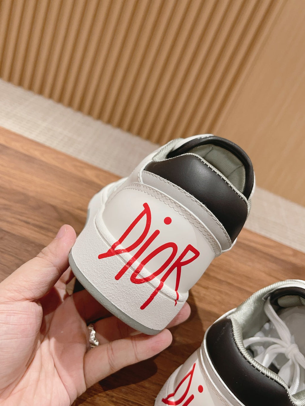 Dior unisex luxury shoes, white slide-in shoe with red Dior logo on strap panel