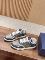 Unisex Dior low-top sneakers, navy and cream, with monogram panels and white laces