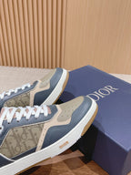 Dior low-top sneakers with navy and cream uppers, monogram toe panel and white laces