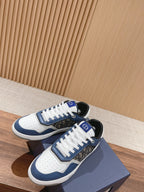 Unisex low-top sneakers with white laces, blue sides, and patterned inserts