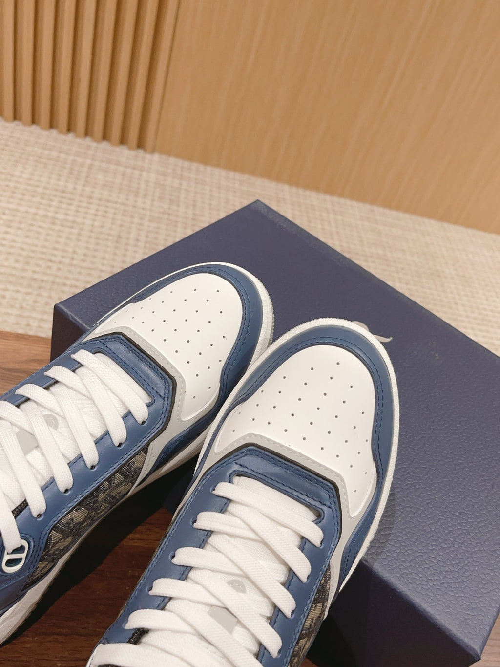 Unisex sneaker toe caps with perforations and blue-and-white upper panels