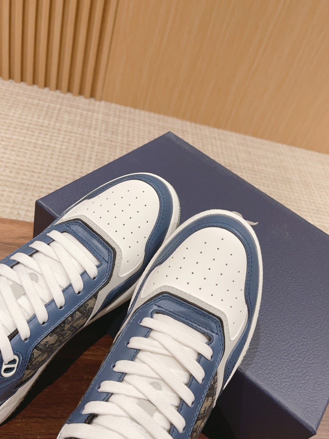 Unisex sneaker toe caps with perforations and blue-and-white upper panels