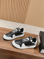 Black and white lace-up sneakers on display with contrasting white side stripe