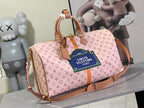 Louis Vuitton duffel bag with pink monogram canvas and tan leather handles