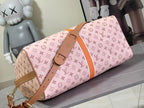 Pink monogram duffel bag with tan strap and front buckle detail