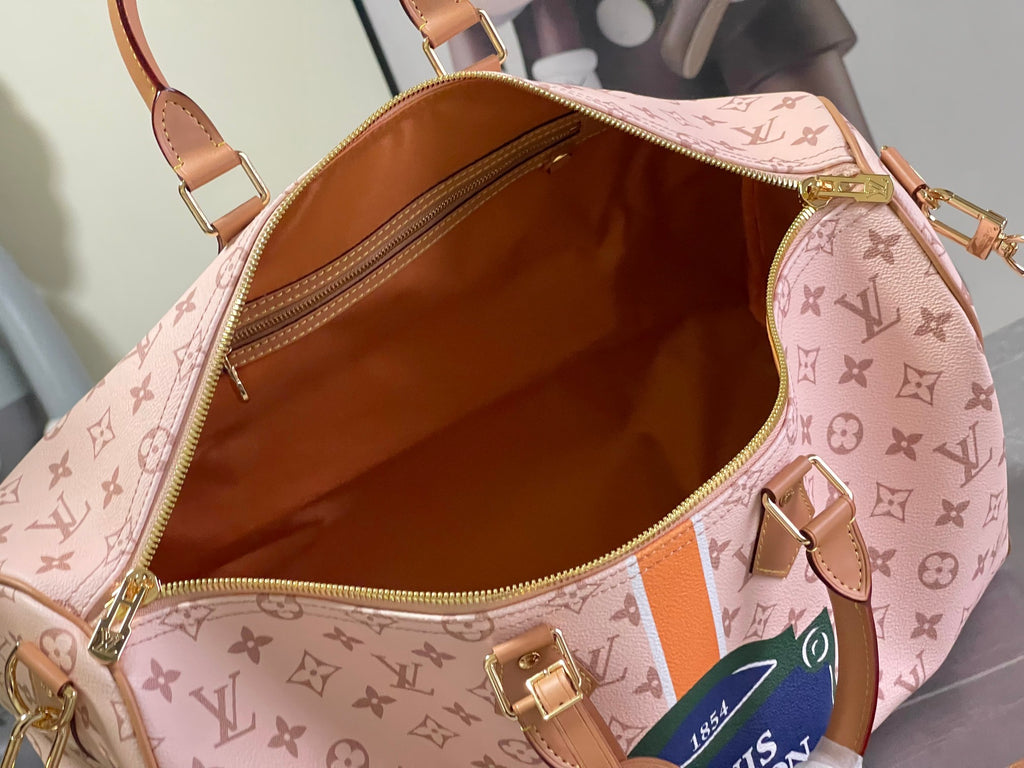 Pink monogram duffel bag open interior with tan lining and zipper pull