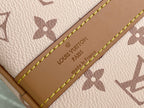 Beige leather tag on Louis Vuitton bag with embossed 'Louis Vuitton Paris' text