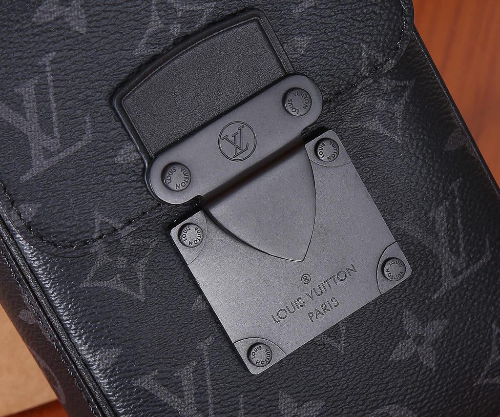 Louis Vuitton bag close-up of logo hardware and interior card in dark leather