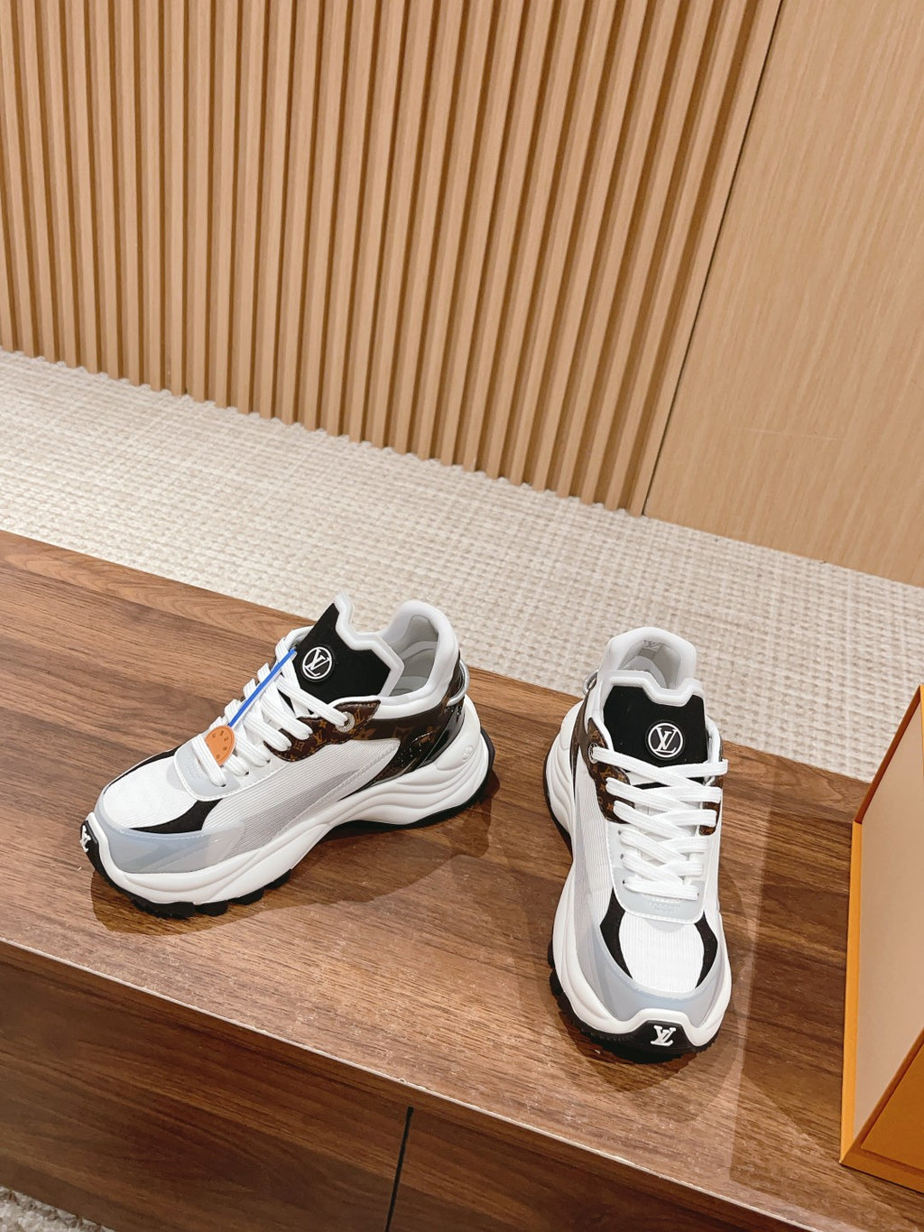 Louis Vuitton unisex lace-up sneakers, white uppers with black accents and blue detail