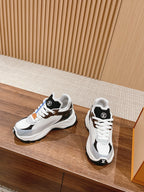 Louis Vuitton unisex lace-up sneakers, white uppers with black accents and blue detail