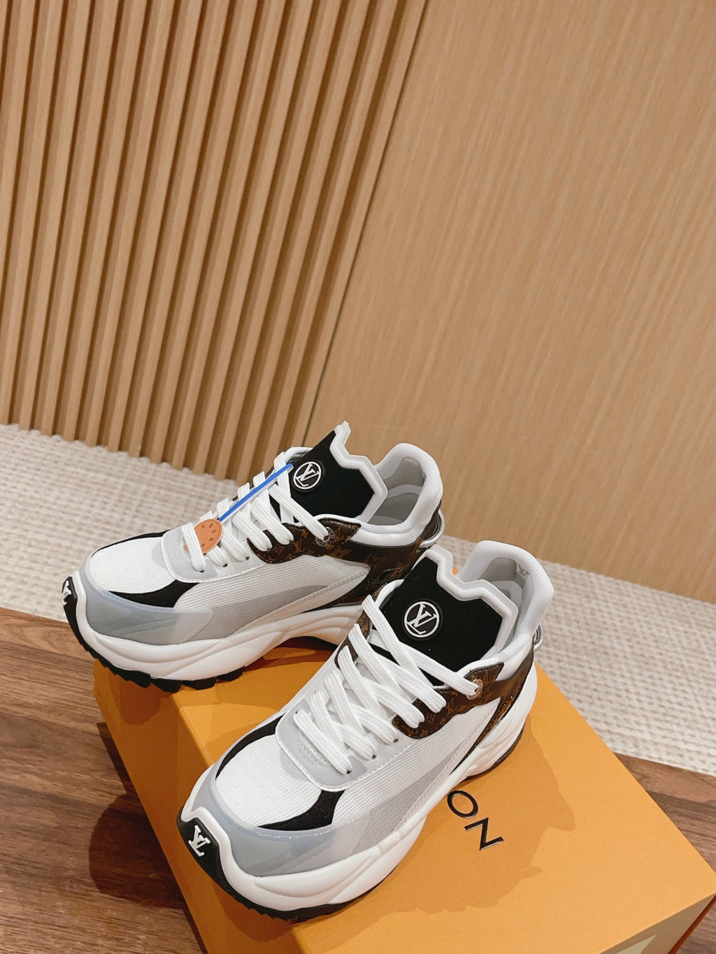 Louis Vuitton unisex lace-up sneakers pair, white uppers with brown/black trim and laces