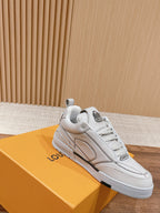 White Louis Vuitton leather sneakers, lace-up, side view with one shoe on box