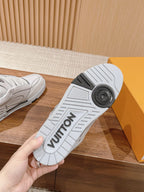 Louis Vuitton white sneaker outsole, textured tread with logo lettering, bottom view