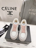 Chanel white low-top sneakers with pink lace-up detailing and plush sherpa lining