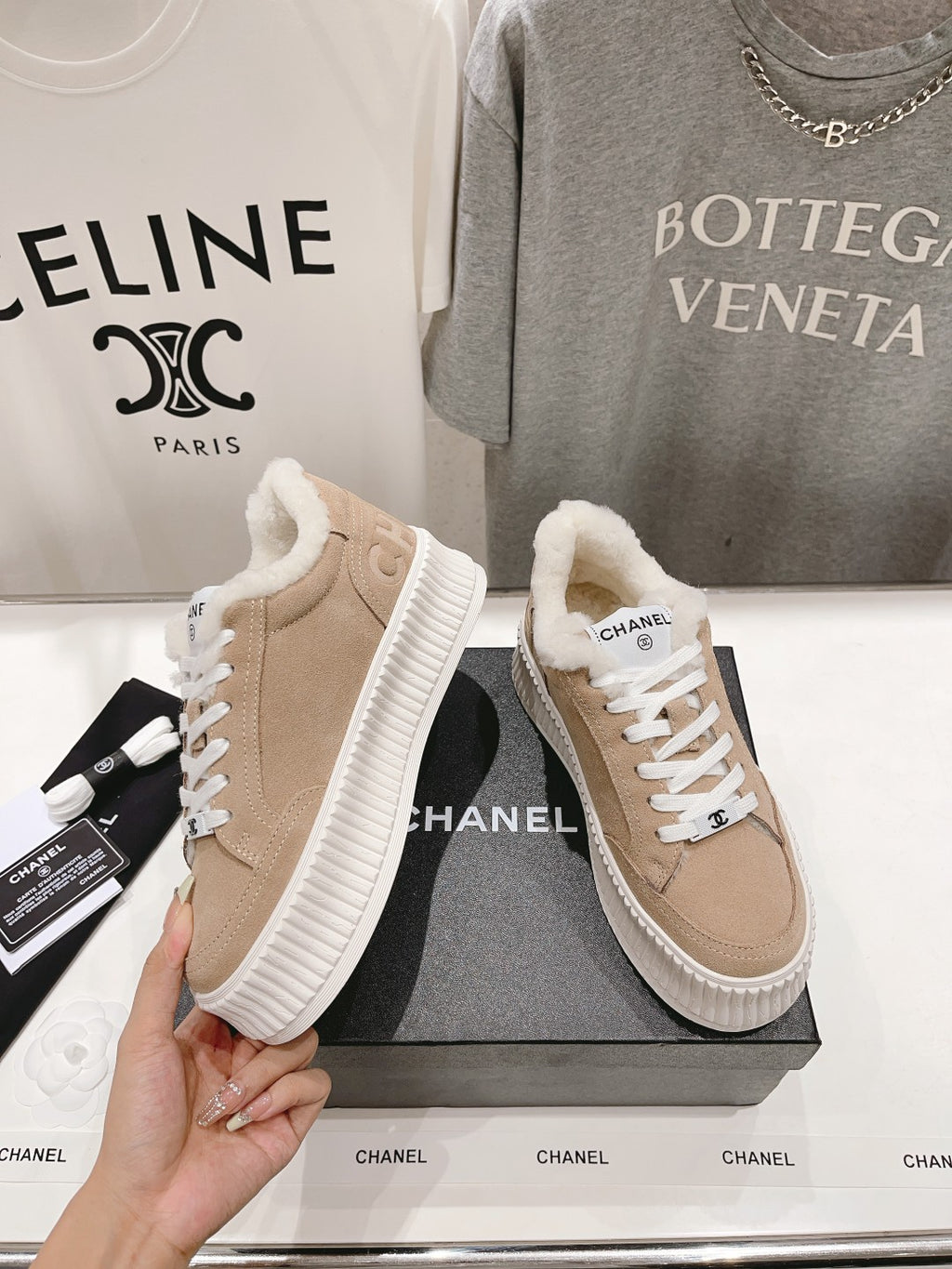 Women’s beige Chanel sneakers, white laces, plush collar, thick white rubber sole