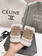 Women’s beige Chanel sneakers heel view, plush shearling trim and white rubber sole