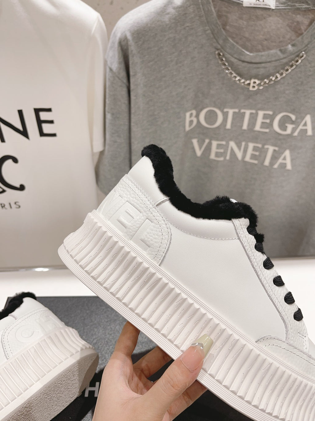 Women’s Chanel sneakers, white side panel with embossed logo and black faux-fur collar