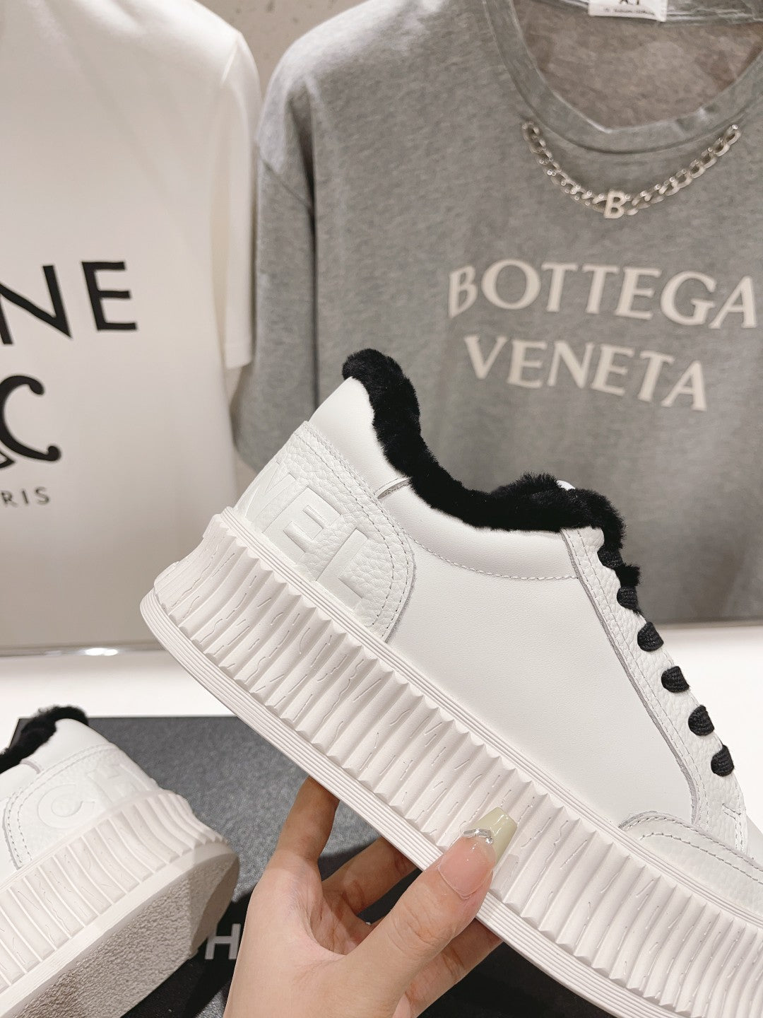 Women’s Chanel sneakers, white side panel with embossed logo and black faux-fur collar