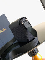 Dior crossbody bag with flap buckle and adjustable strap, dark side view