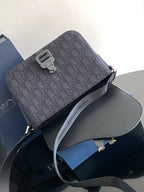 Dior crossbody bag front view with top buckle and adjustable strap, dark pattern