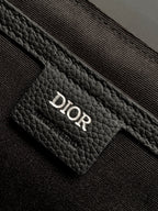 Dior leather pocket detail with Dior embossing on textured front panel