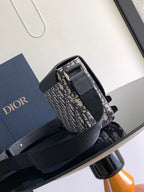 Dior bag top view with black flap and Dior monogram canvas, front buckle