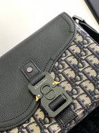 Dior bag close-up: black leather flap with Dior engraved hardware and logo tag