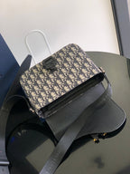 Dior bag with short shoulder strap and Dior monogram canvas, front profile