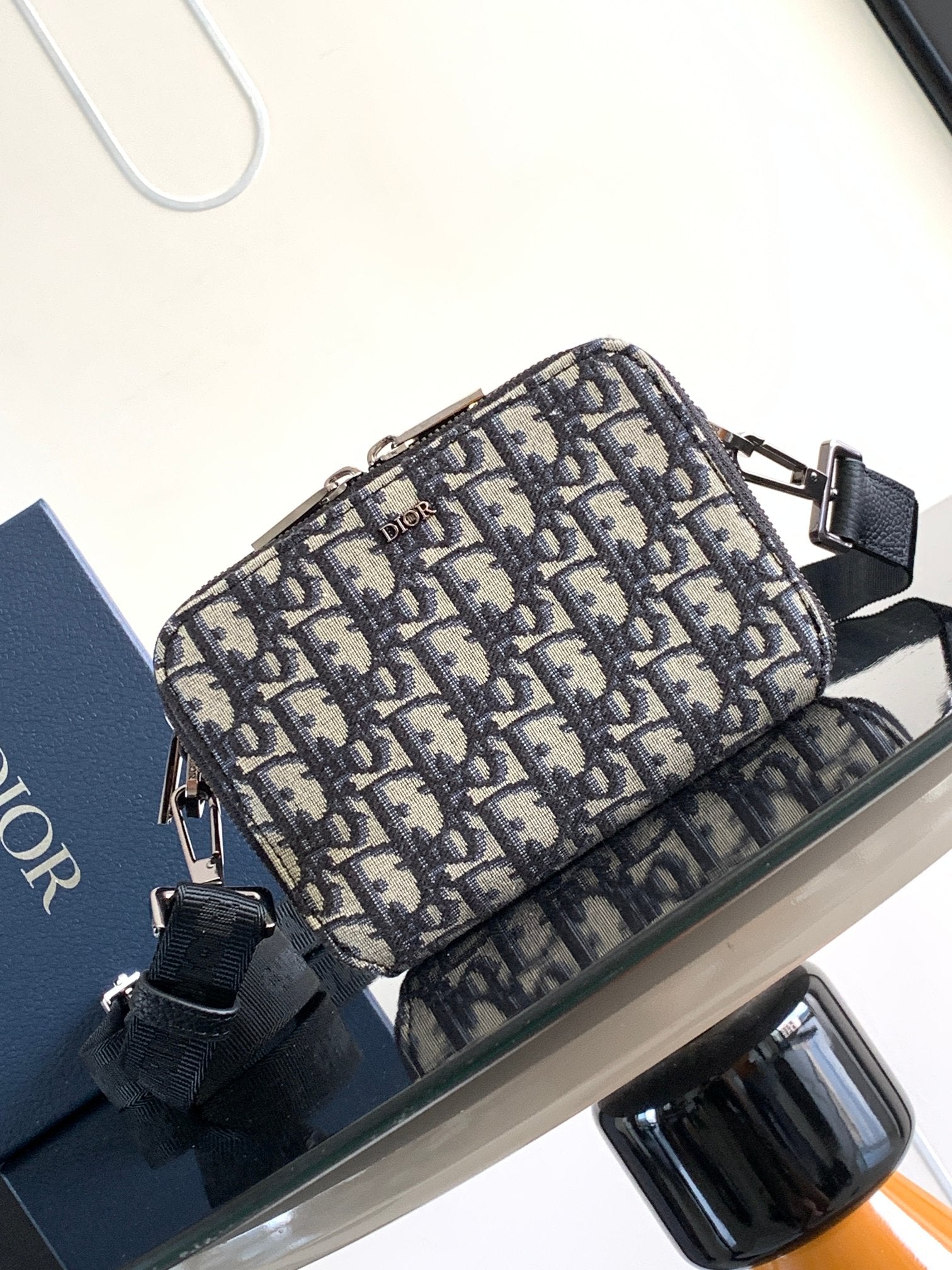 Dior bag crossbody in navy and beige Dior pattern canvas with black strap and hardware