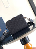 Dior bag in dark navy monogram canvas with dual silver zippers and shoulder strap