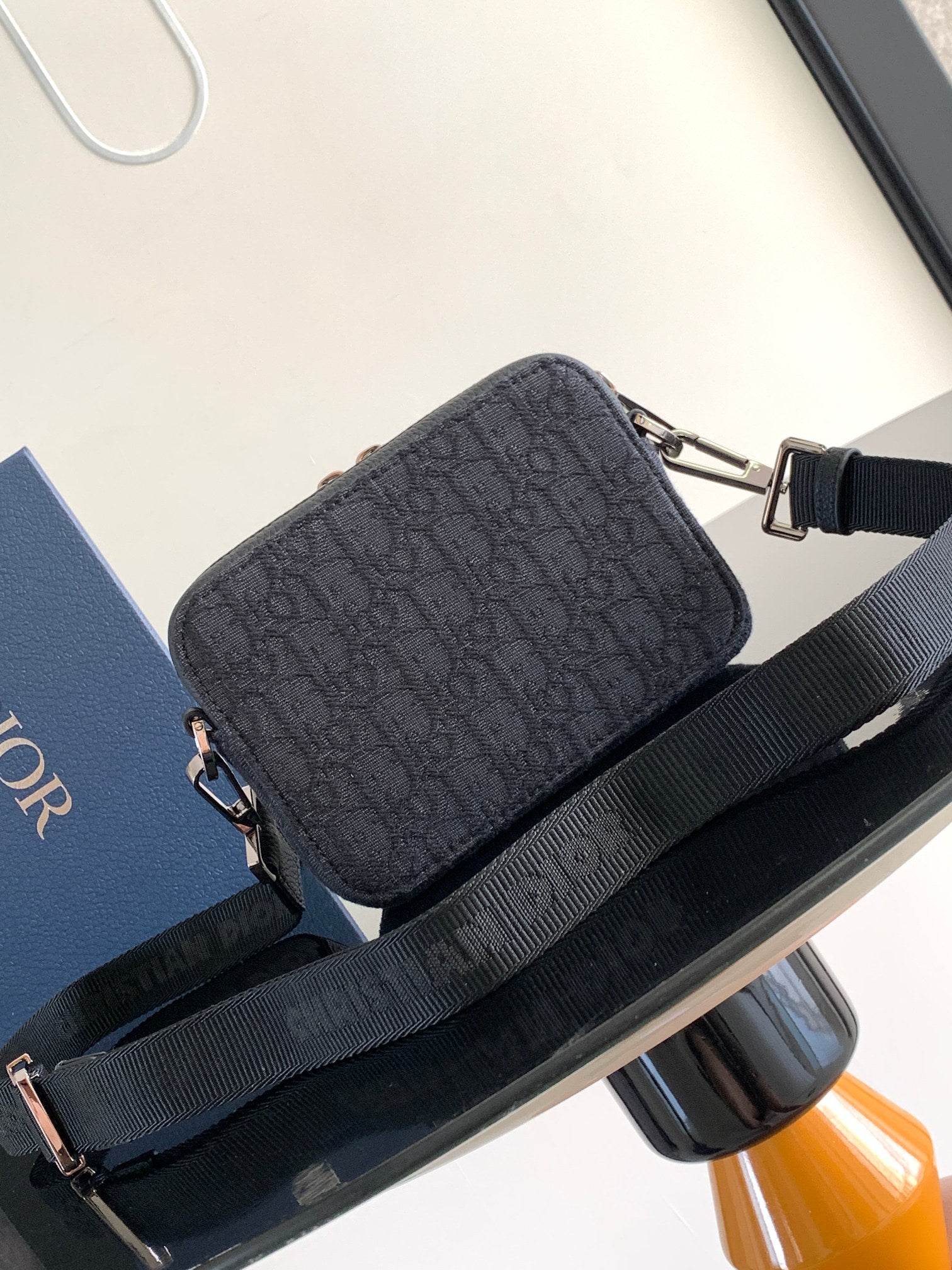 Dior bag dark navy monogram canvas with crossbody strap and silver hardware