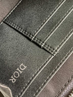 Dark fabric strap with stitched edge and Dior lettering