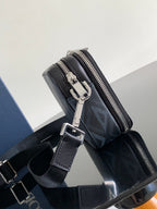 Navy structured crossbody bag with front zip pocket and metal hardware