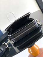 Black crossbody bag with top handle and front zip pockets
