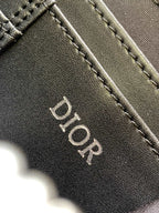 Black leather Dior logo tab with edge stitching