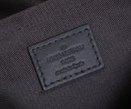 Louis Vuitton leather brand label reading “LOUIS VUITTON PARIS” and “made in Spain”